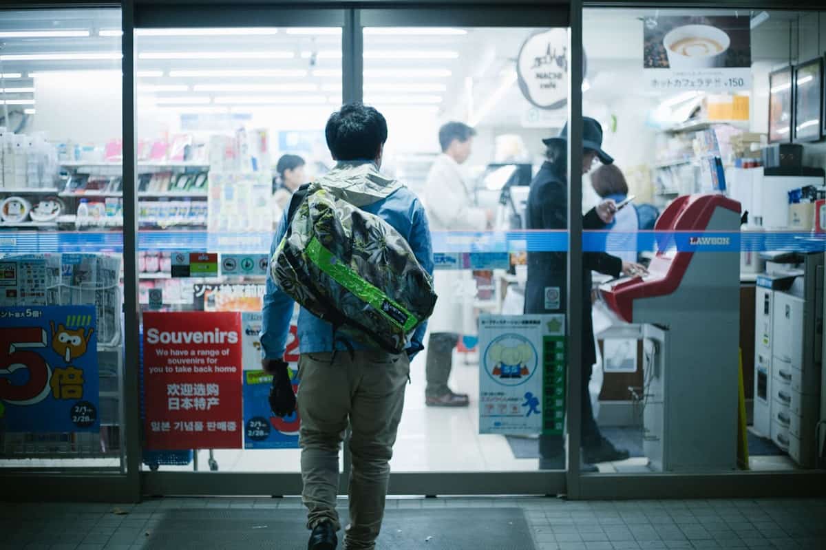 Man entering Japanese convenience store